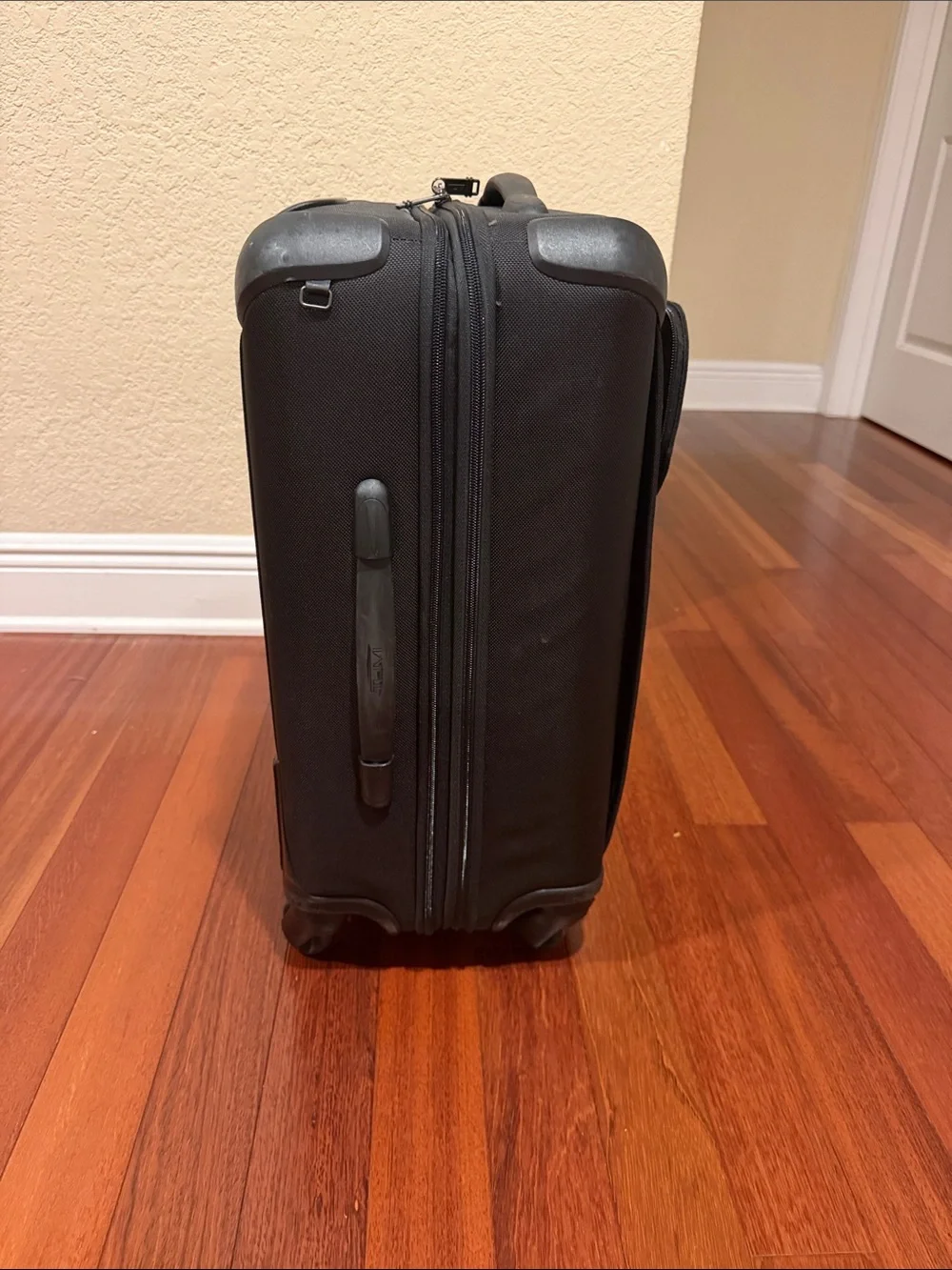 Tumi Black Carry-On Spinner with Front Zip Pocket